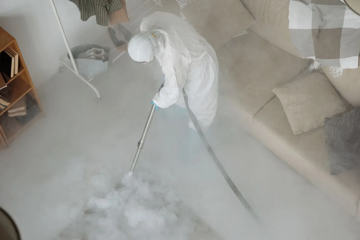 Biohazard cleanup technician in protective equipment, North Plymouth, MA